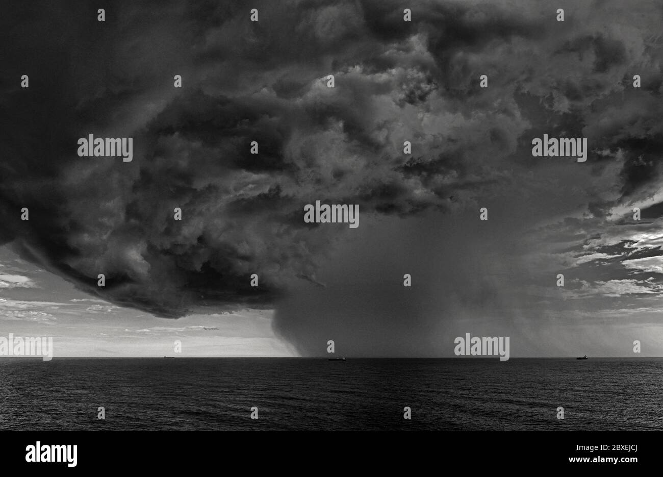 off shore rio grande 32.16 s  051.54 w, brazil - 2014.02.02: an enormous  cumulonimbus cloud developing over the south atlantic ocean preceding a heav Stock Photo