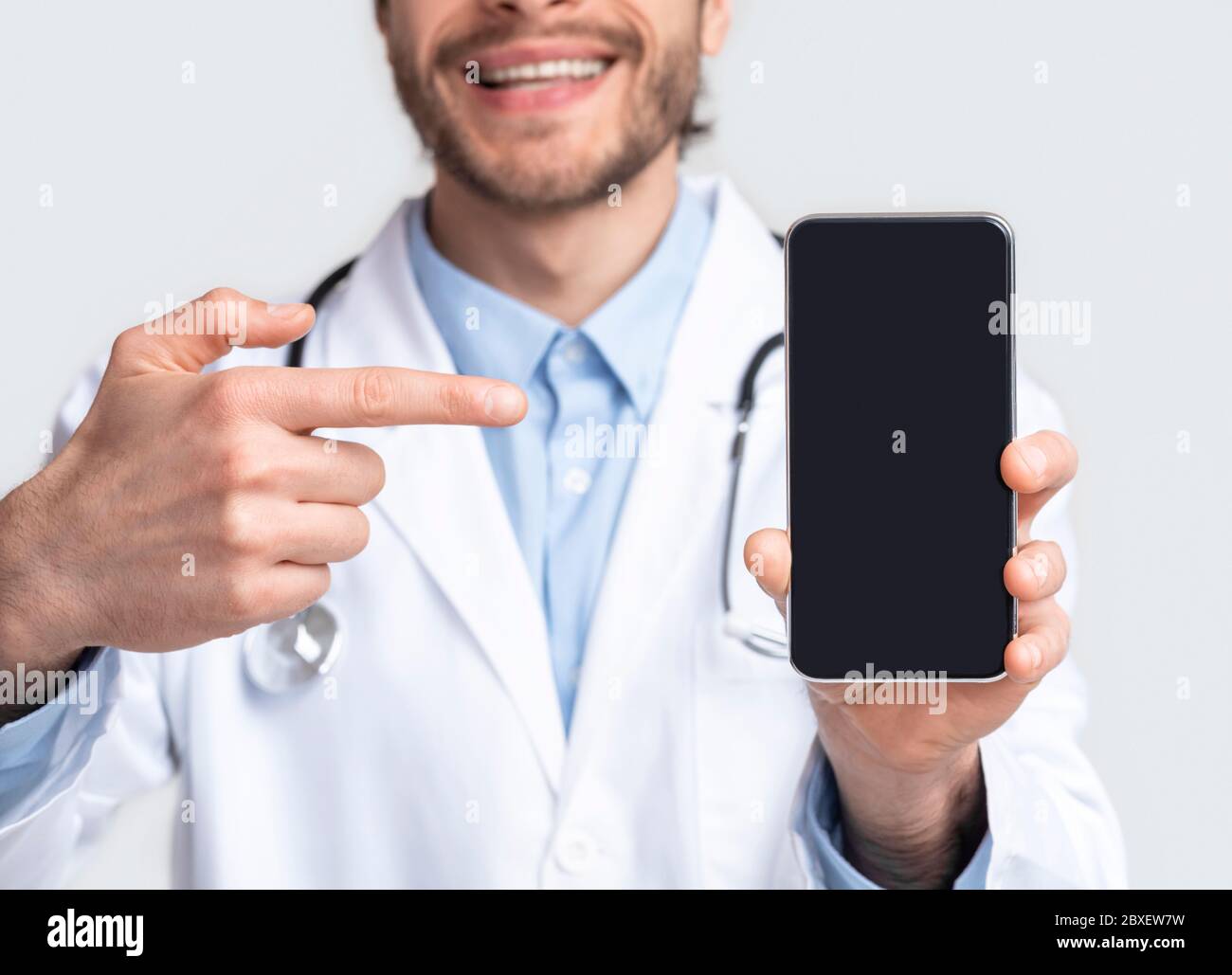 Medapplication Blank smartphone for med application in doctor's hands Stock Photo - Alamy