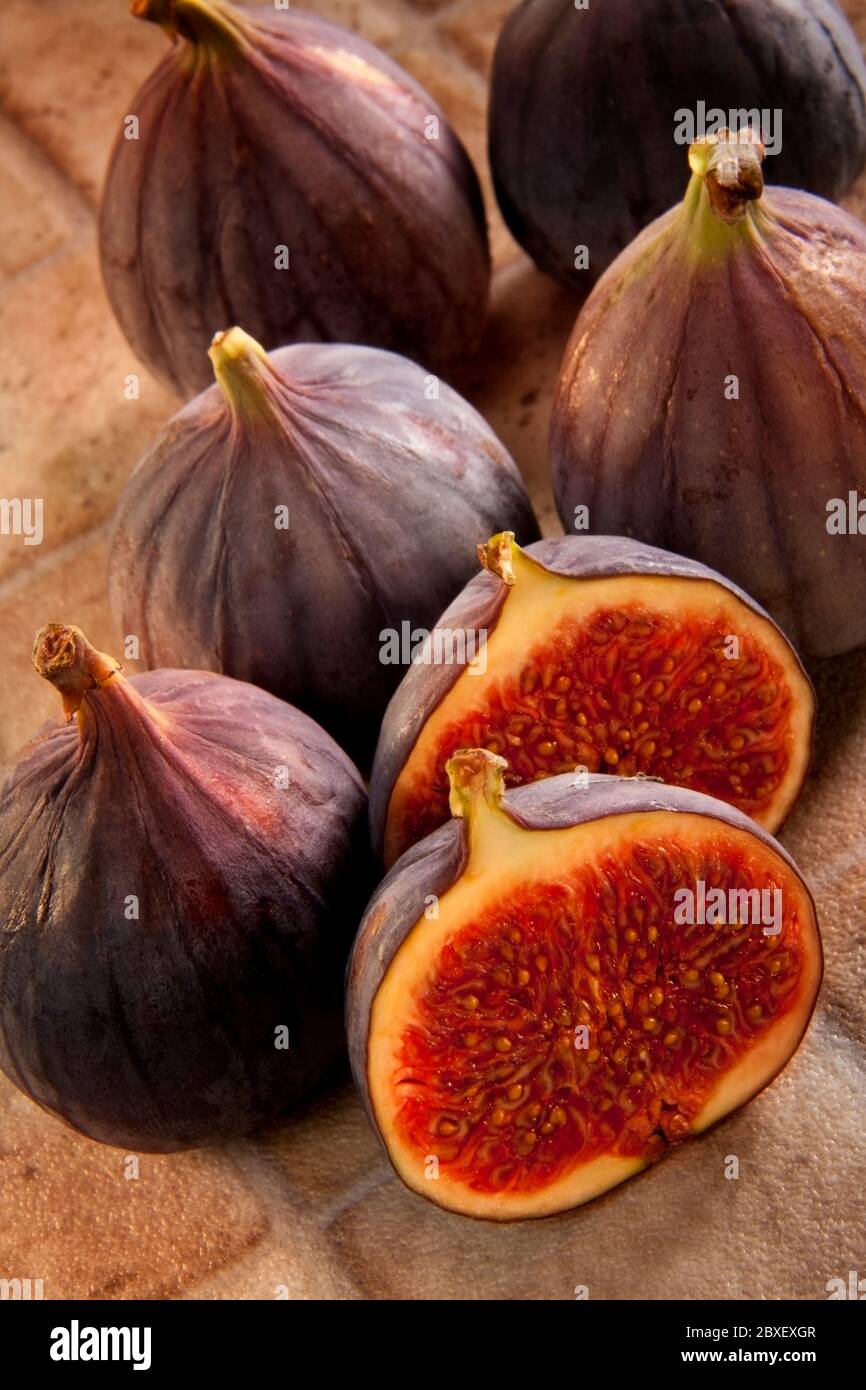 A fig is a soft edible pearshaped fruit with sweet dark flesh and many small seeds. It can be