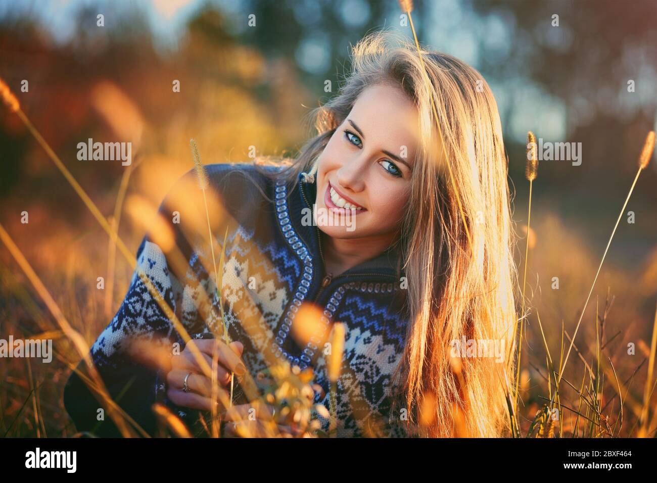 Beautiful smiling woman with blue eyes . Seasonal portrait in nature Stock Photo