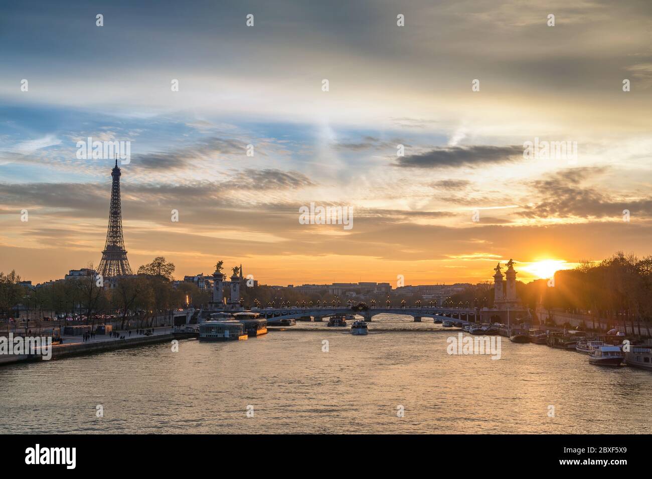 Paris France sunset city skyline at Seine River with Pont Alexandre III bridge and Eiffel Tower Stock Photo