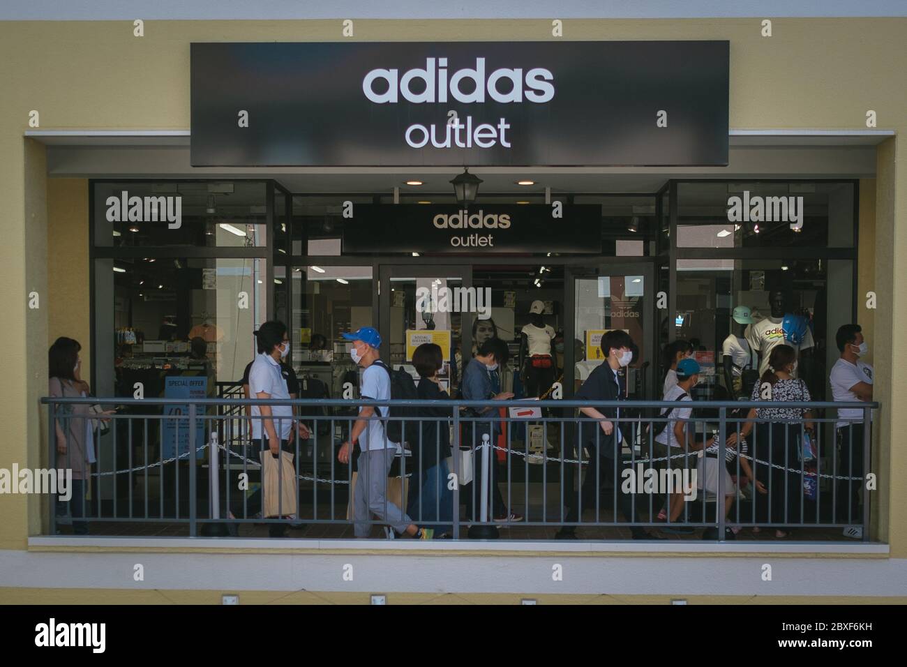 Customers queue with social distancing in an outlet park on June 07, 2020  in Tokyo, Japan. Tokyo Central government still monitoring spread of the  coronavirus disease (COVID-19) inside the Japanese capital city.