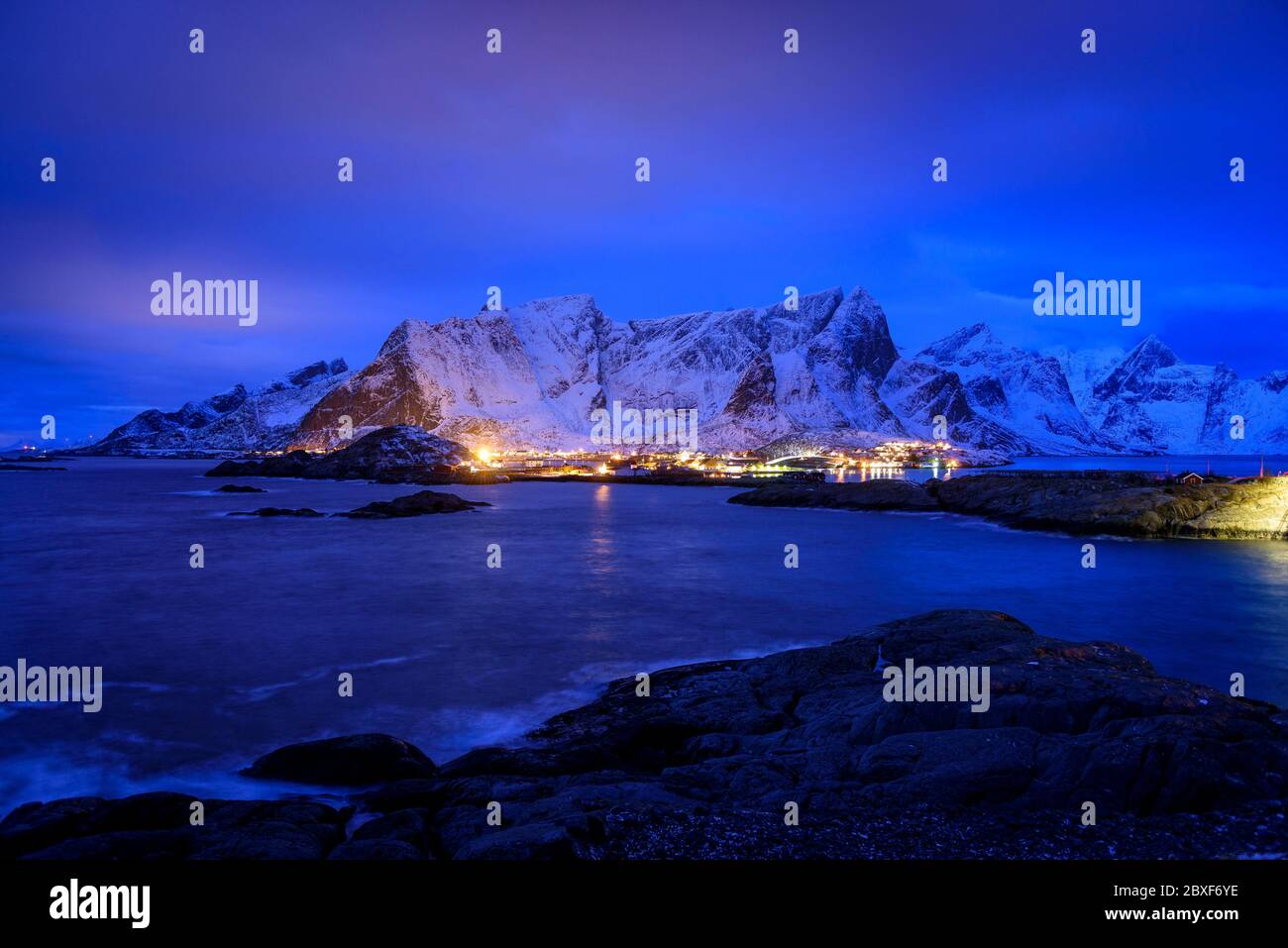Reine village and fjord at the blue hour  (Reinefjorden, Moskenesøya, Lofoten, Norway) ESP: Pueblo, badía y fiordo de Reine, a la hora azul (Lofoten) Stock Photo