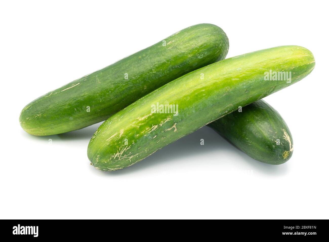 Three cucumbers on an isolated white background Stock Photo