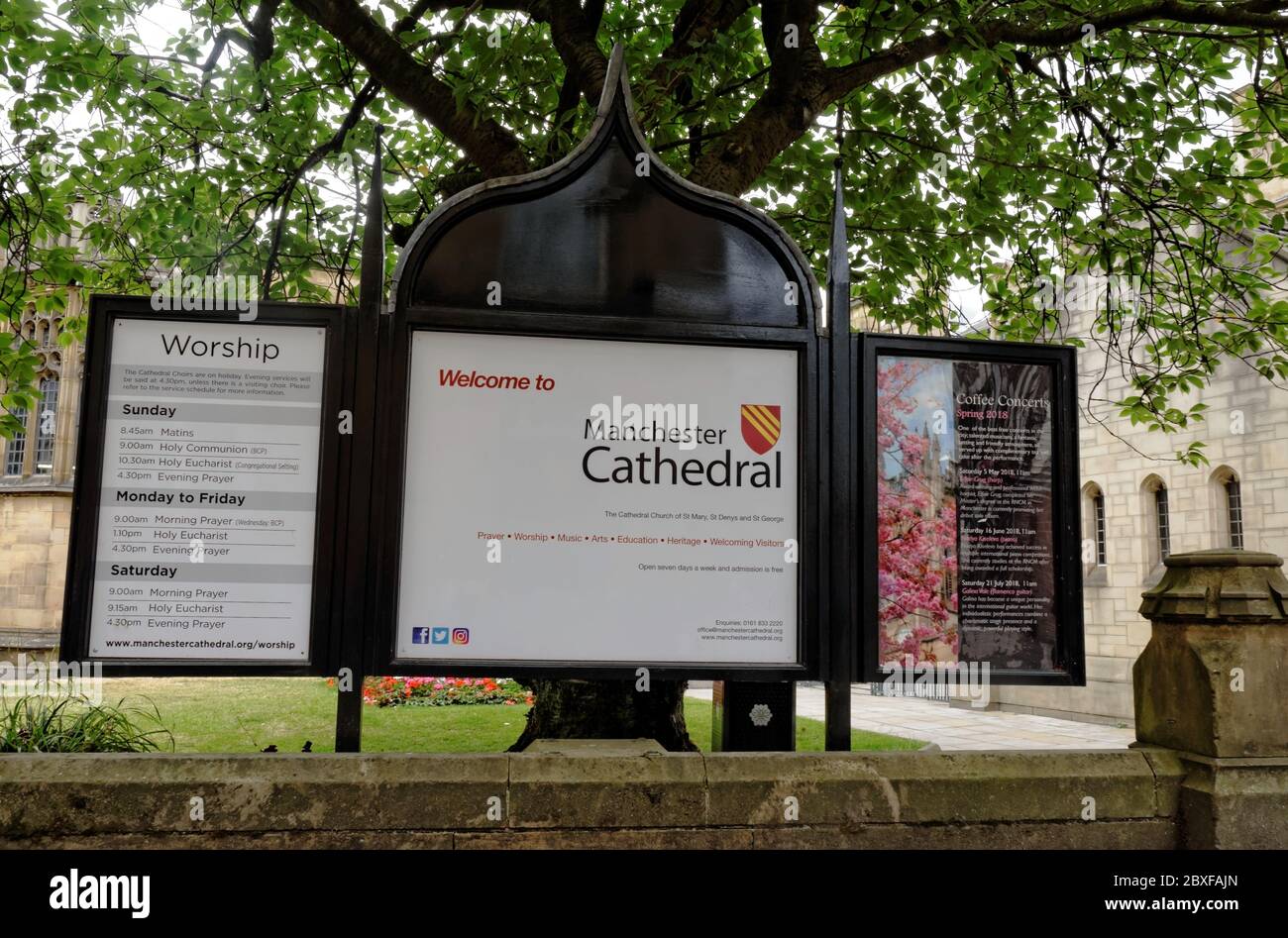 Welcome to Manchester Cathedral sign. Prayer, worship, music, arts, education, heritage and welcoming visitors. Times of worship. Coffee concerts. Stock Photo