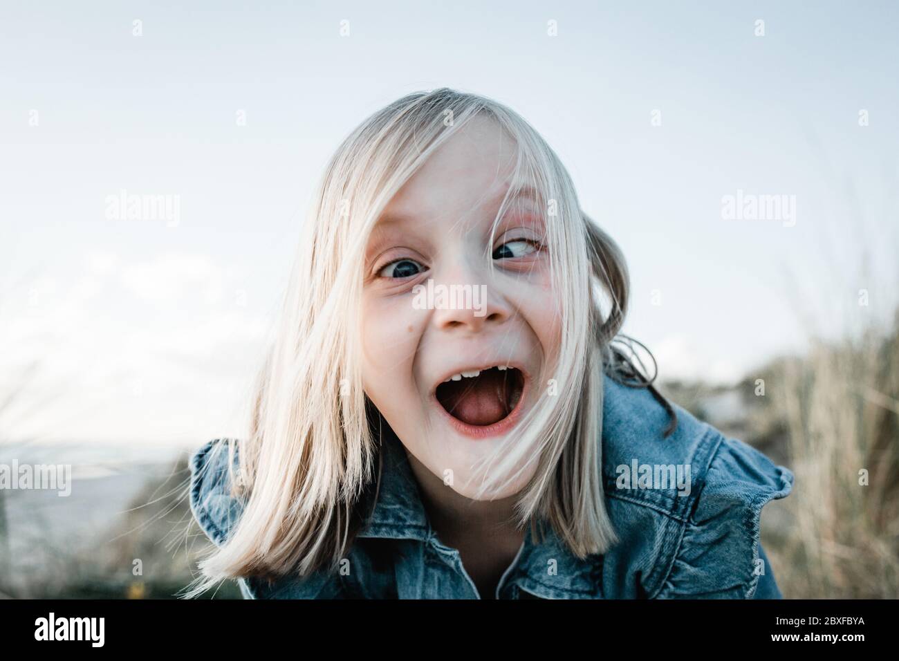 Young girl doing a funny face Stock Photo