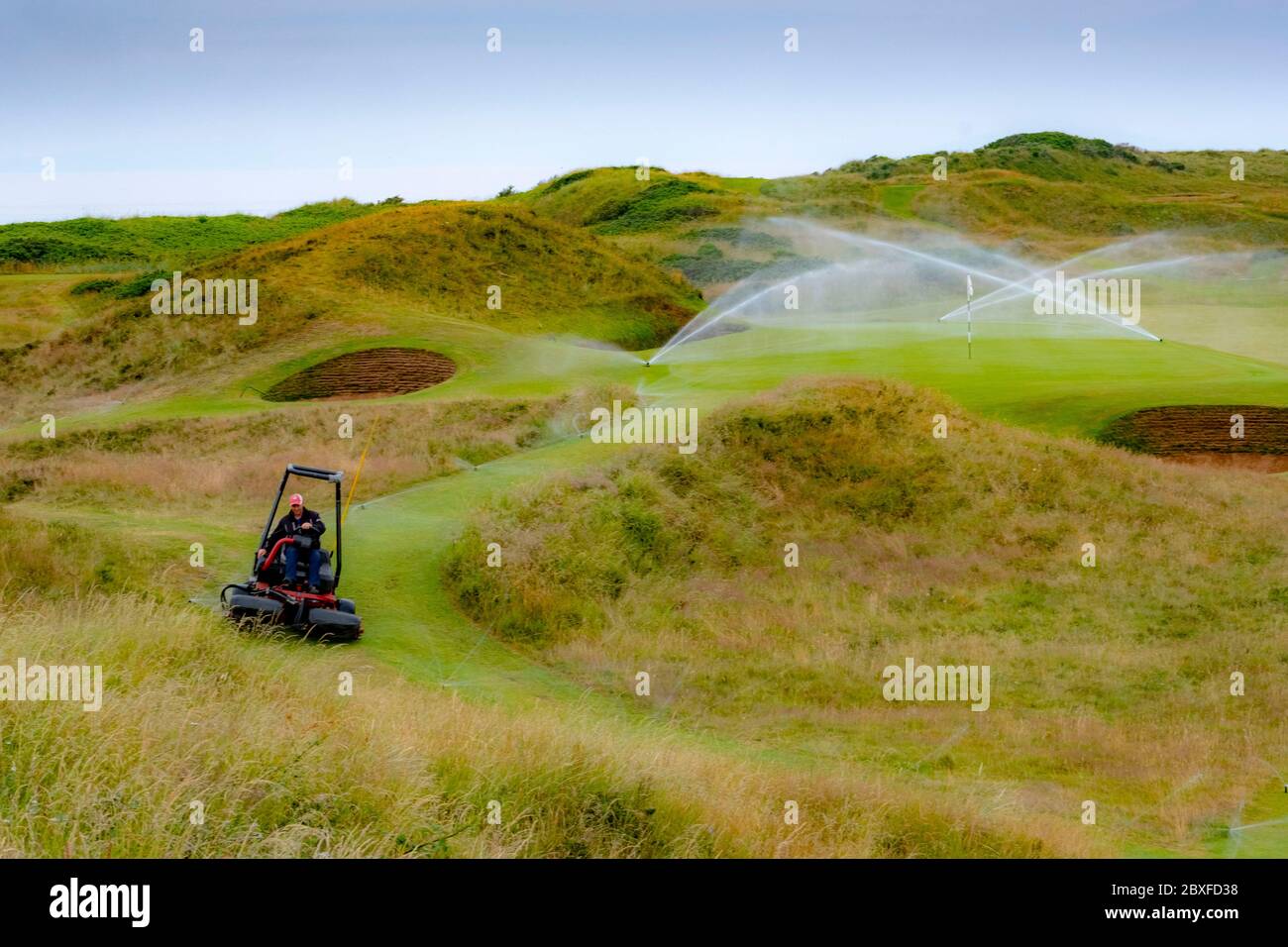Irrigation system on golf course Stock Photo