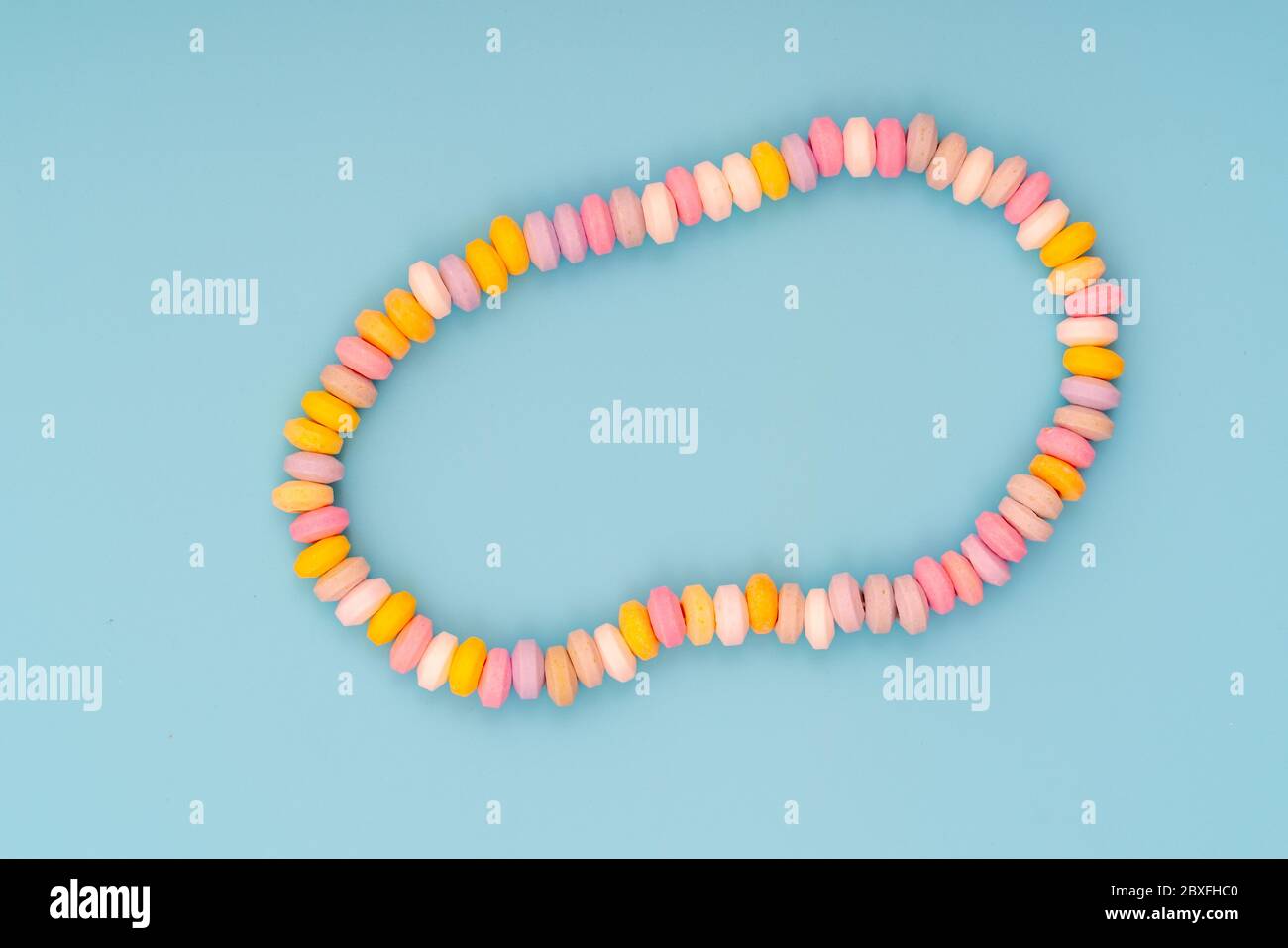 sweets Beads and bracelets candy on a pink background Stock Photo