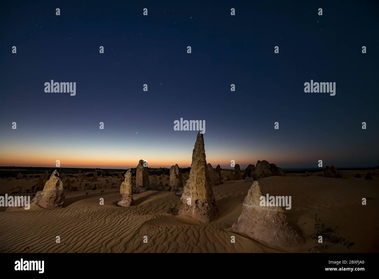 Limestone stacks light painted at night in the Nambung national park, Western Australia Stock Photo