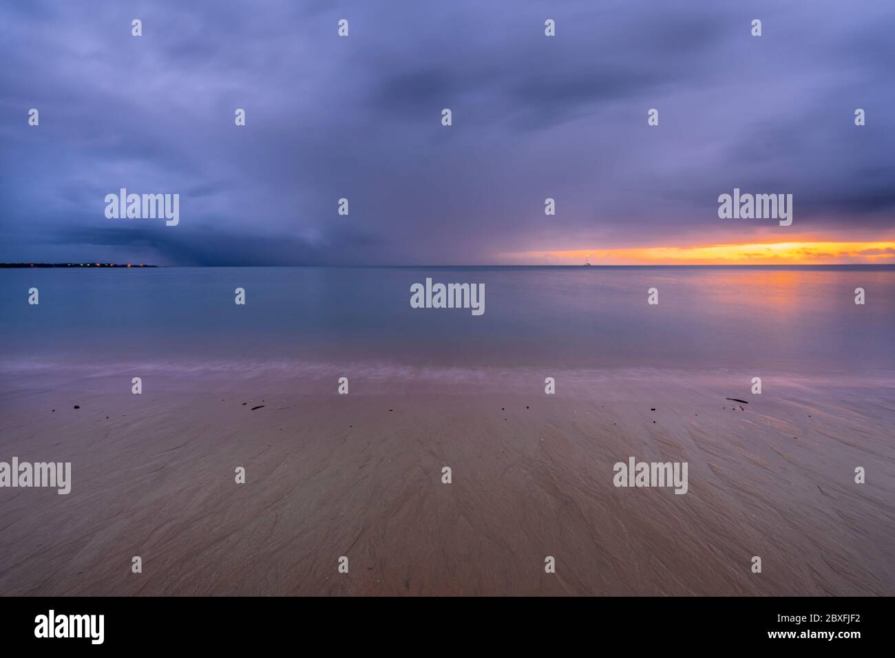 Storm clouds over Hervey Bay at dawn, Queensland, Australia Stock Photo