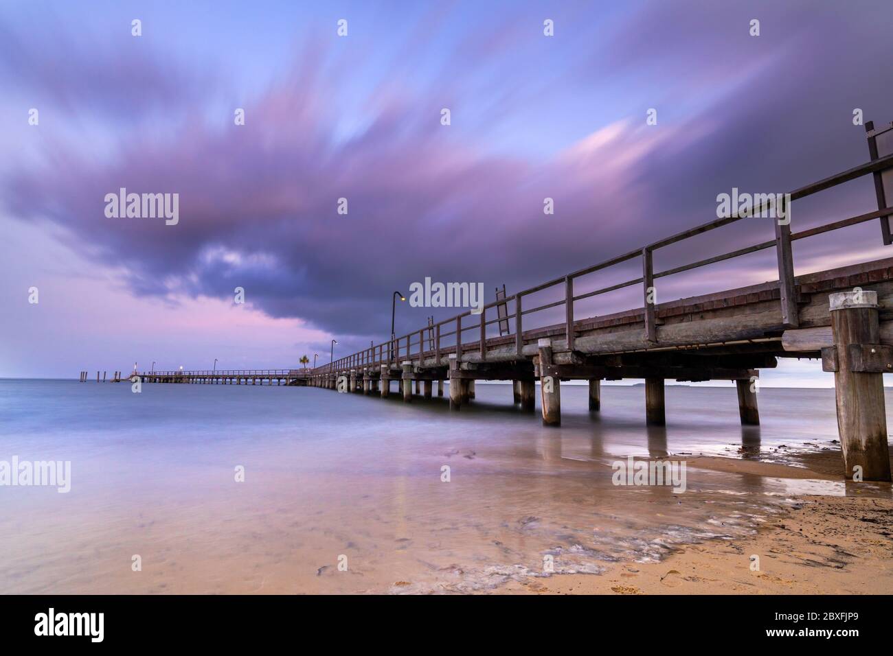 Kingfisher Bay wooden jetty at dawn, Fraser Island Queensland Australia Stock Photo