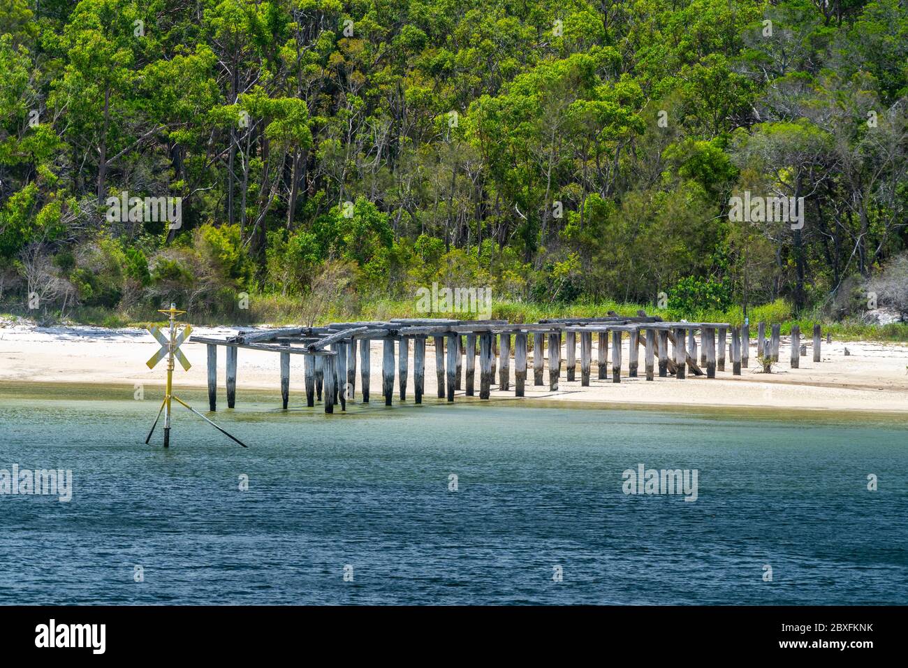 The remains of the MacKenzies Landing timber loading jetty, North White Cliffs, Fraser Island, Queensland Australia Stock Photo