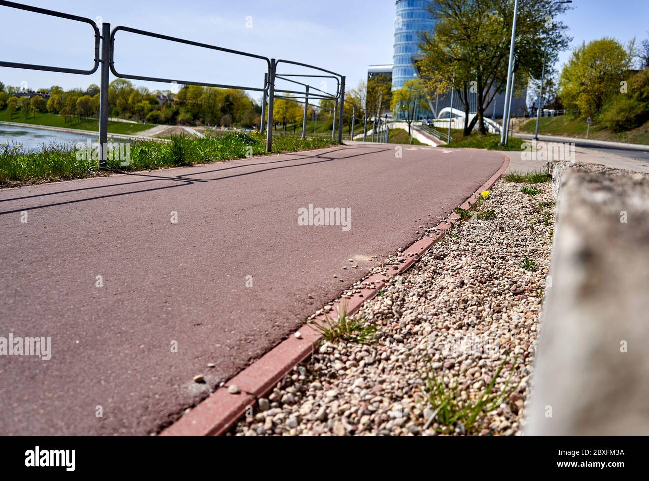 Red asphalt bicycle lane in the city Stock Photo