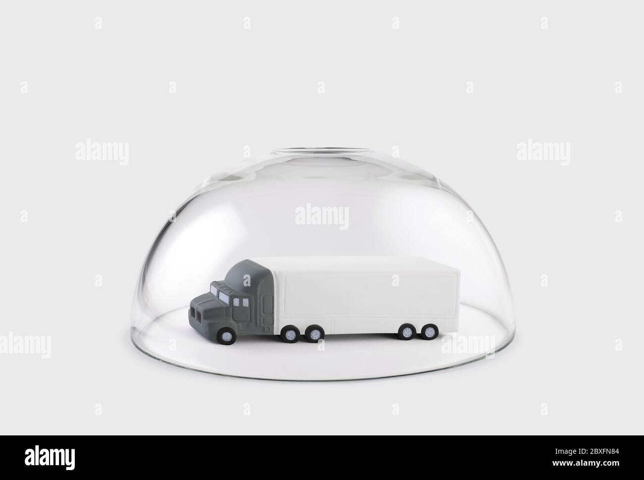 Long truck with a trailer protected under a glass dome Stock Photo