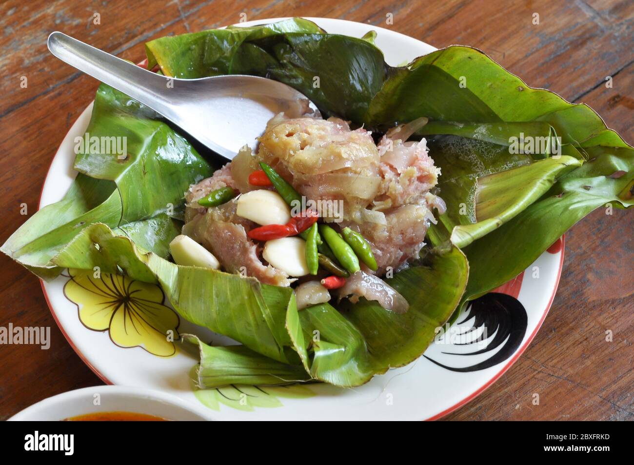 Sour pork or Nham is a popular native foods commonly consumed in the local the north of Thailand. Stock Photo