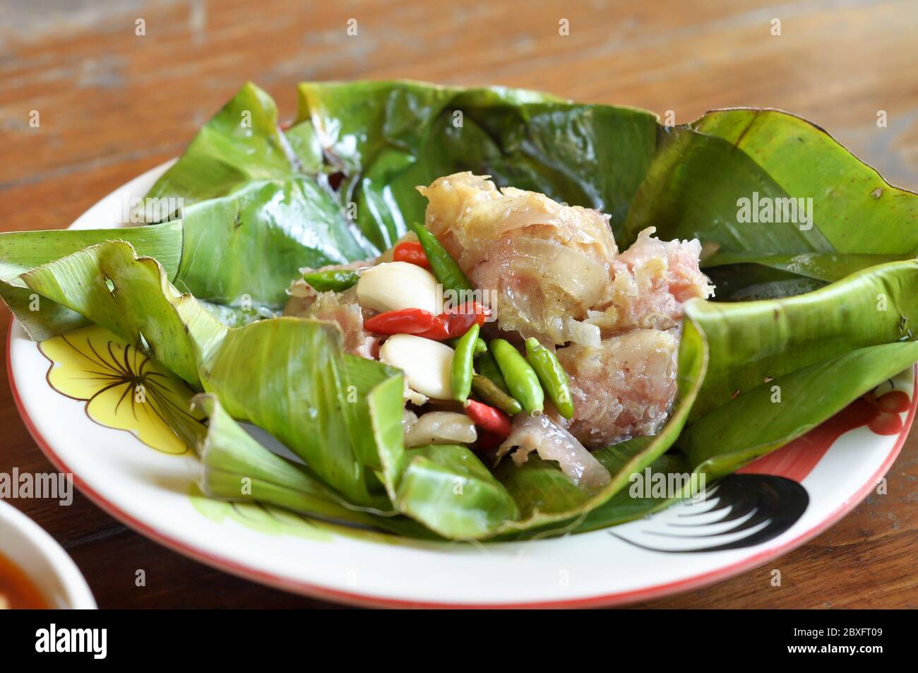 Sour pork or Nham is a popular native foods commonly consumed in the local the north of Thailand. Stock Photo