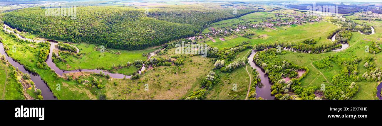 aerial drone landscape of river in green field, top view of beautiful nature texture from drone Stock Photo
