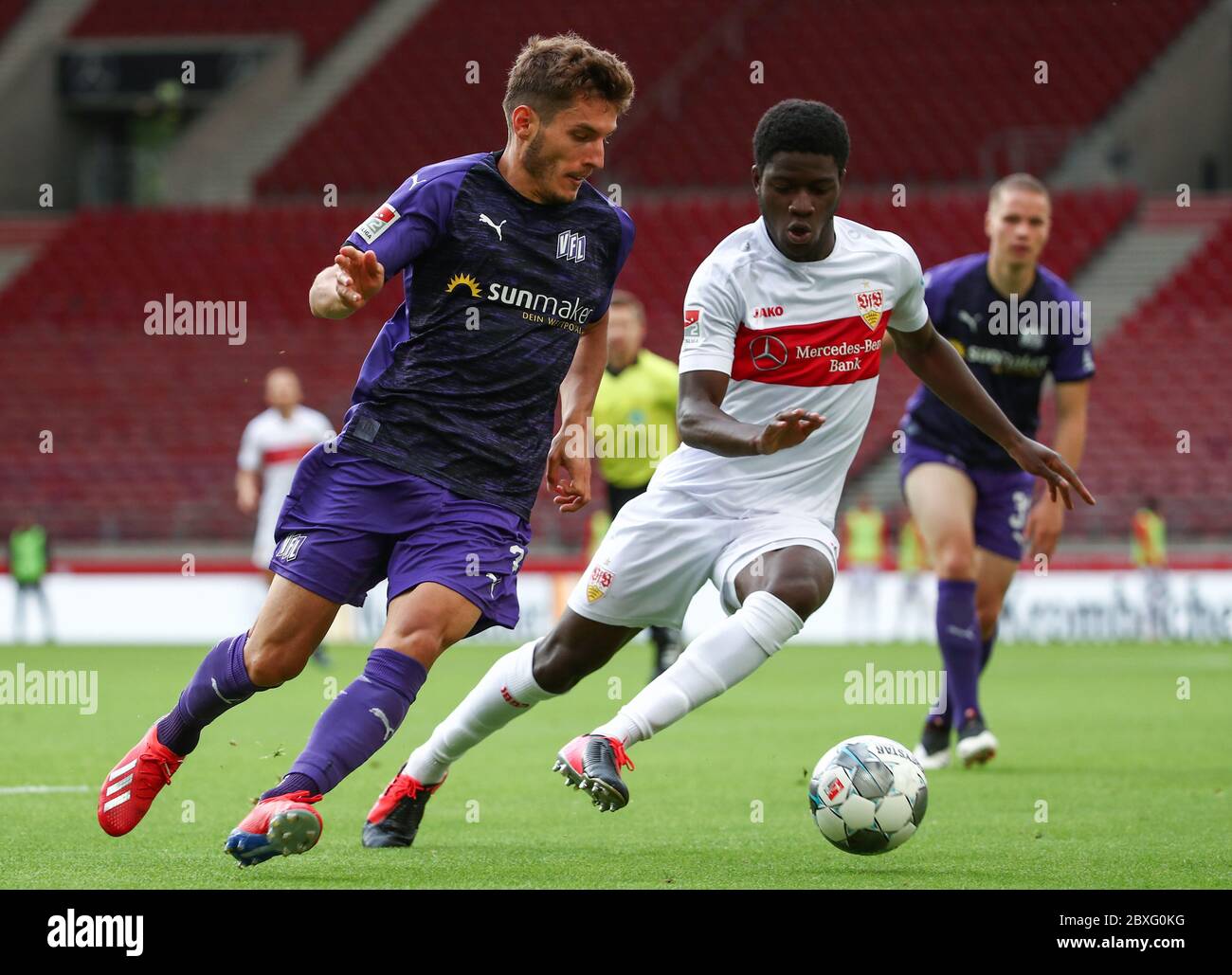 Stuttgart, Germany. 07th June, 2020. Football: 2nd Bundesliga, VfB Stuttgart - VfL Osnabrück, 30th matchday in the Mercedes-Benz Arena. Osnabrück's Bashkim Ajdini in action with Clinton Mola (r) of Stuttgart. IMPORTANT NOTICE: In accordance with the regulations of the DFL Deutsche Fußball Liga and the DFB Deutscher Fußball-Bund, it is prohibited to exploit or have exploited in the stadium and/or from the game taken photographs in the form of sequence images and/or video-like photo series. Credit: Tom Weller/dpa-Pool/dpa/Alamy Live News Stock Photo