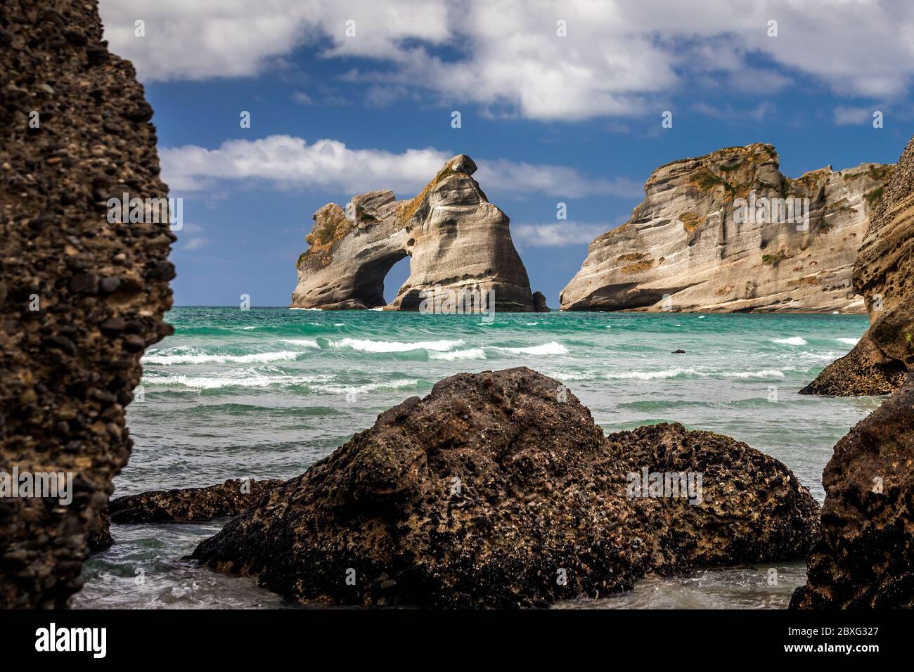 Famous rock formations on the Wharariki beach in National Park. Nelson, South Island, New Zealand. Stock Photo