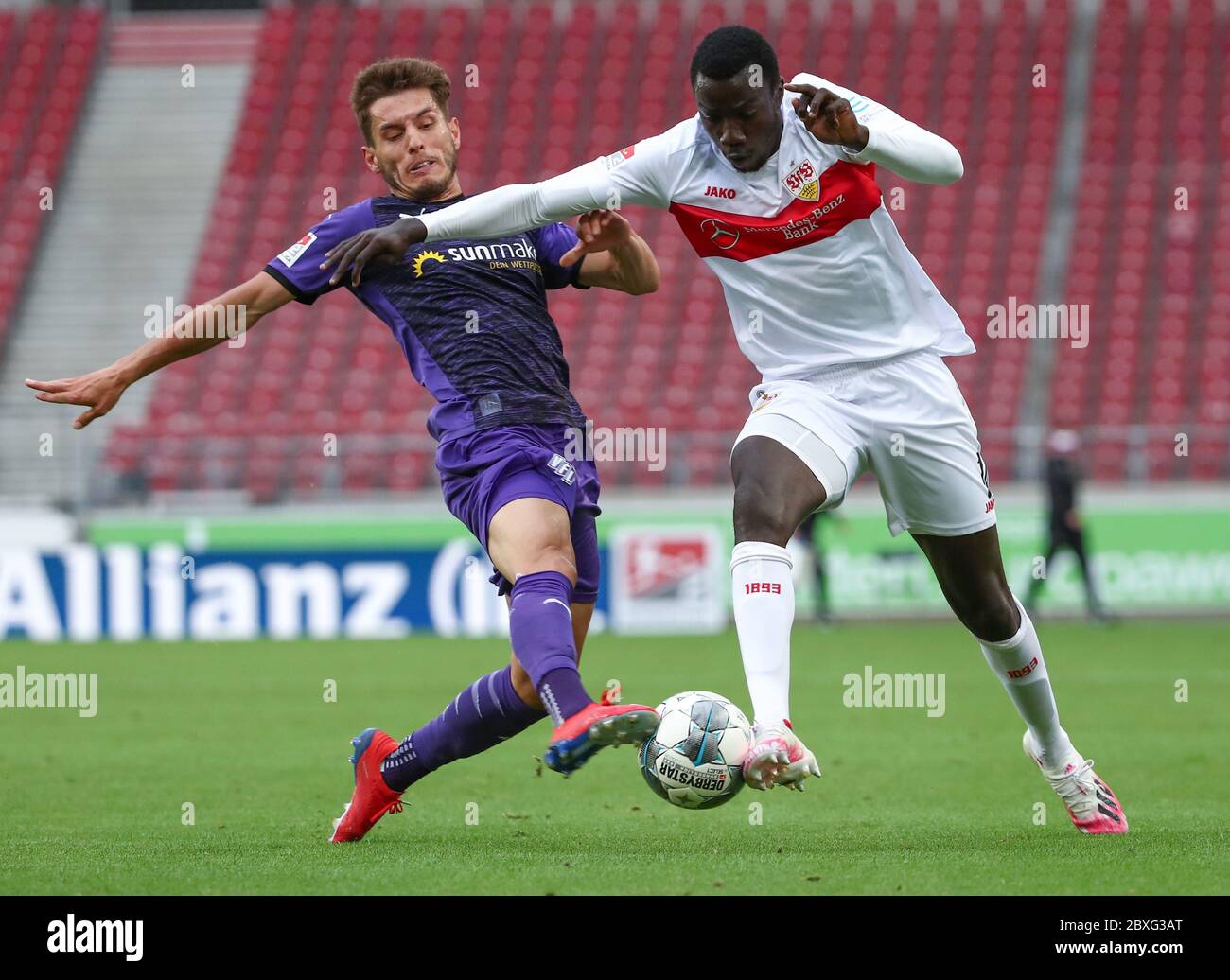 Stuttgart, Germany. 07th June, 2020. Football: 2nd Bundesliga, VfB Stuttgart - VfL Osnabrück, 30th matchday in the Mercedes-Benz Arena. Osnabrück's Bashkim Ajdini in action with Tanguy Coulibaly (r) from Stuttgart. IMPORTANT NOTICE: In accordance with the regulations of the DFL Deutsche Fußball Liga and the DFB Deutscher Fußball-Bund, it is prohibited to exploit or have exploited in the stadium and/or from the game taken photographs in the form of sequence images and/or video-like photo series. Credit: Tom Weller/dpa-Pool/dpa/Alamy Live News Stock Photo