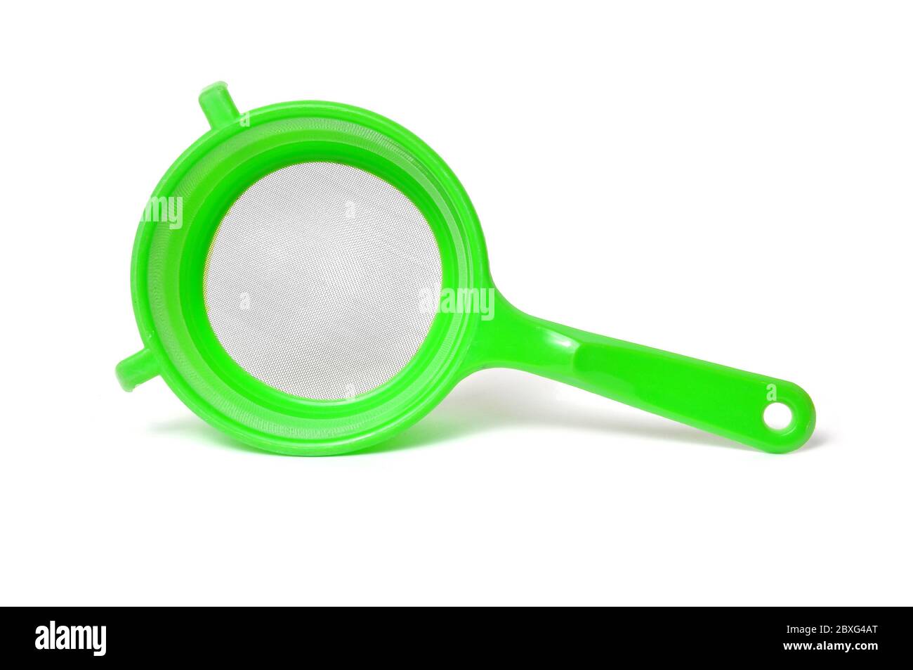 Green handle colander isolated on white background Stock Photo Alamy