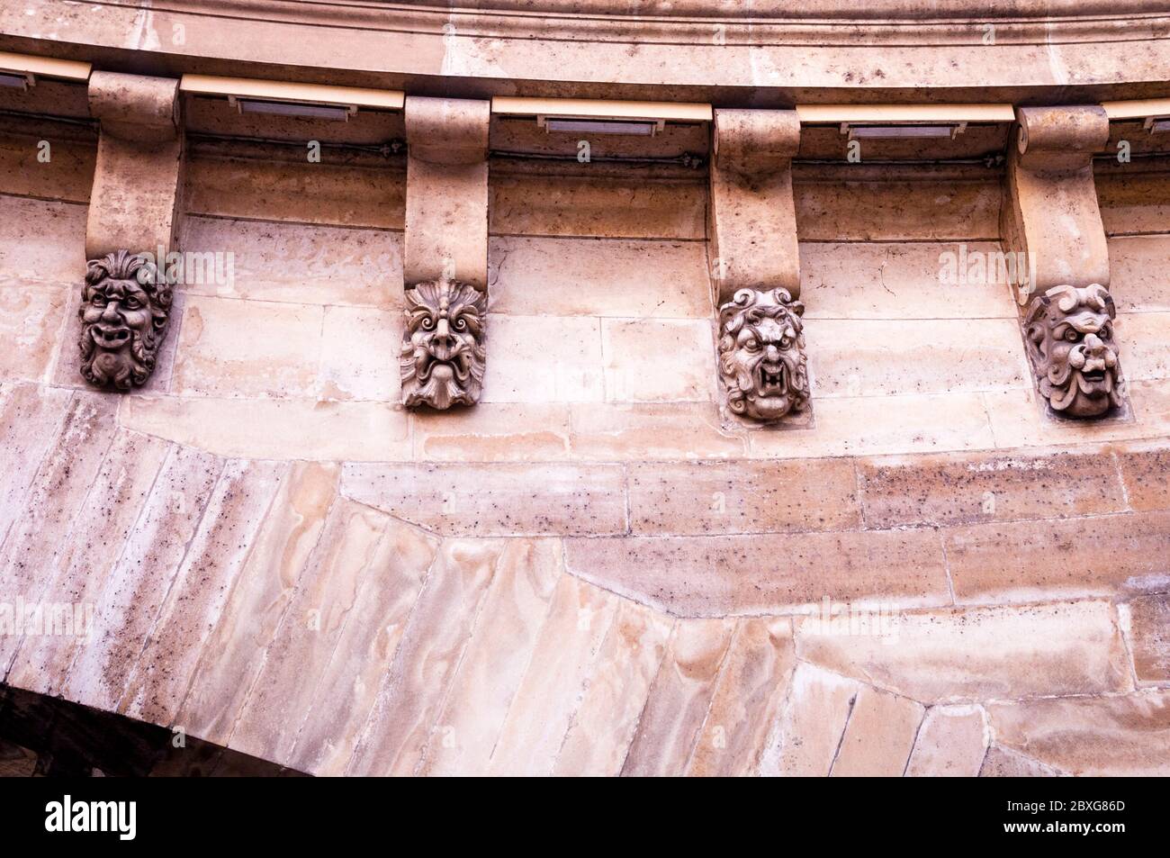 Grotesques, or mascarons, line the Pont Neuf bridge in Paris, France, a unique architectural detail, originally created to warn off evil spirits. Stock Photo