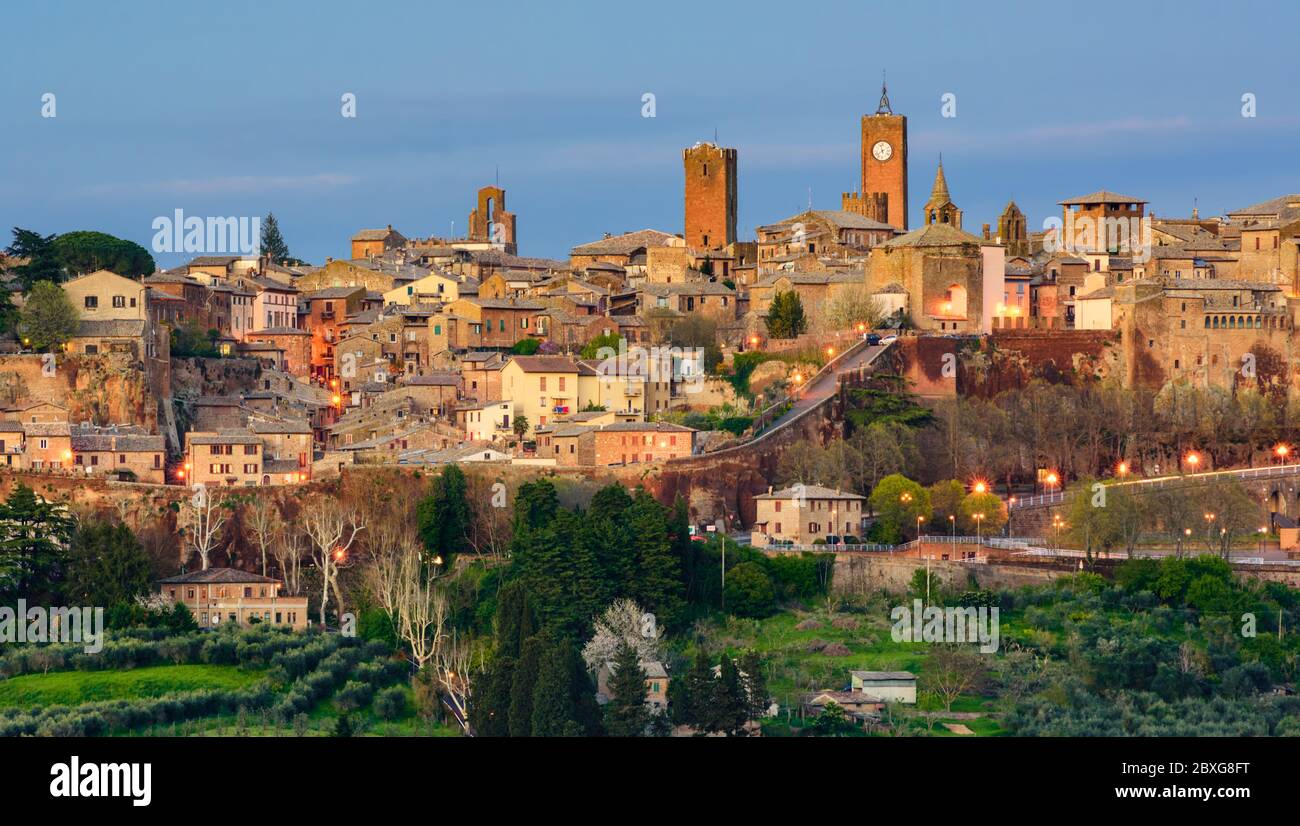 Orvieto medieval hilltop Old town, panoramic view of the medieval walls and towers of the city at late evening Stock Photo