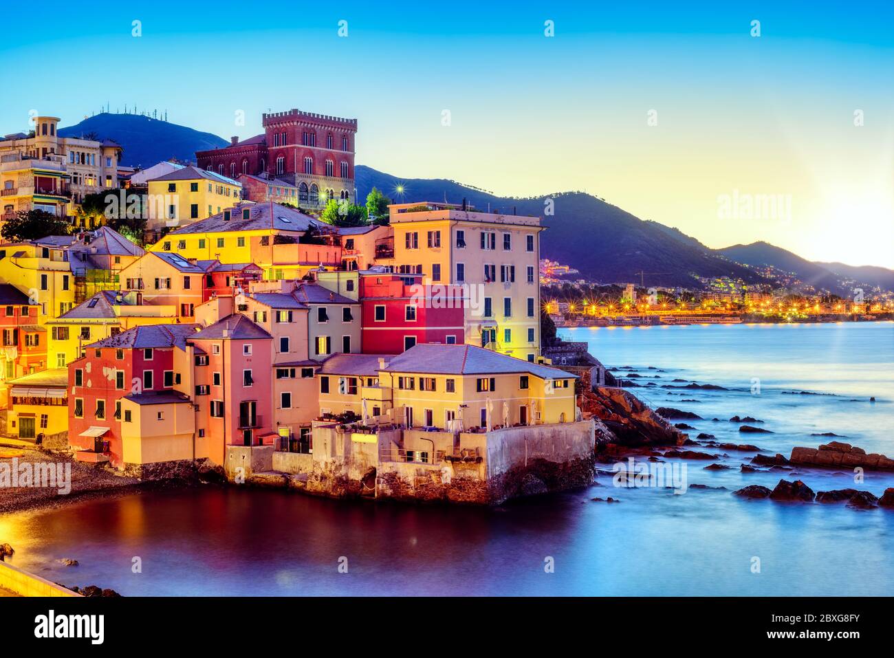 Colorful houses in Boccadasse fishing village on the Mediterranean coast in Genoa city, Ligury, Italy, on sunrise Stock Photo