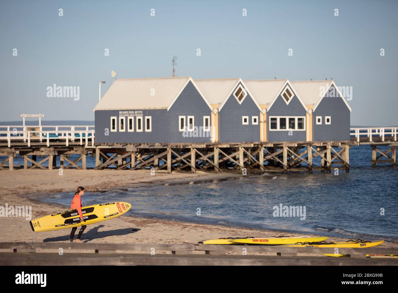 Busselton Western Australia November 9th 2019 : A young member of the Busselton Surf Lifesaving club carrying a surfboard down to the beach Stock Photo