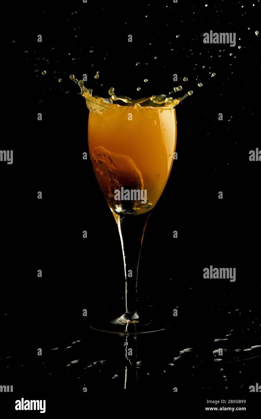 Orange juice splash on black hi-res stock photography and images - Alamy