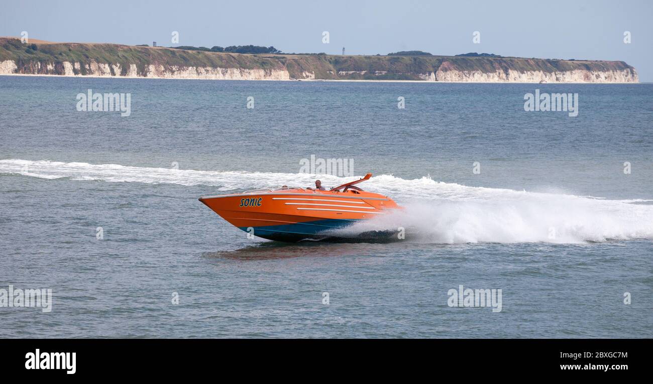 Holidaymakers returning to Bridlington harbour after a trip round the bay on the speedboat 'Sonic' Stock Photo