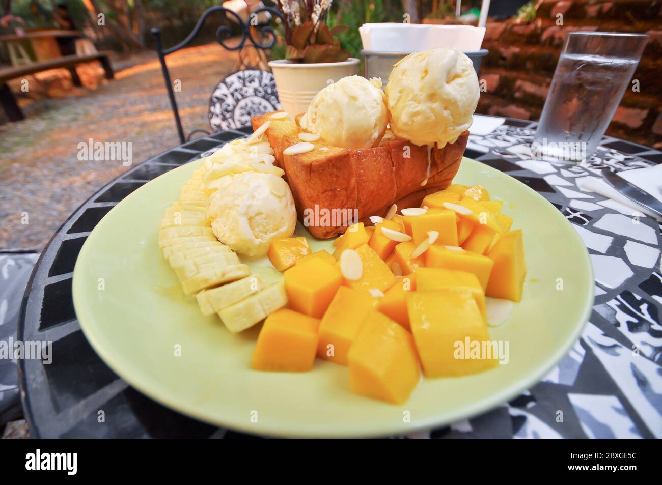 Honey toast with banana and mango. Stock Photo