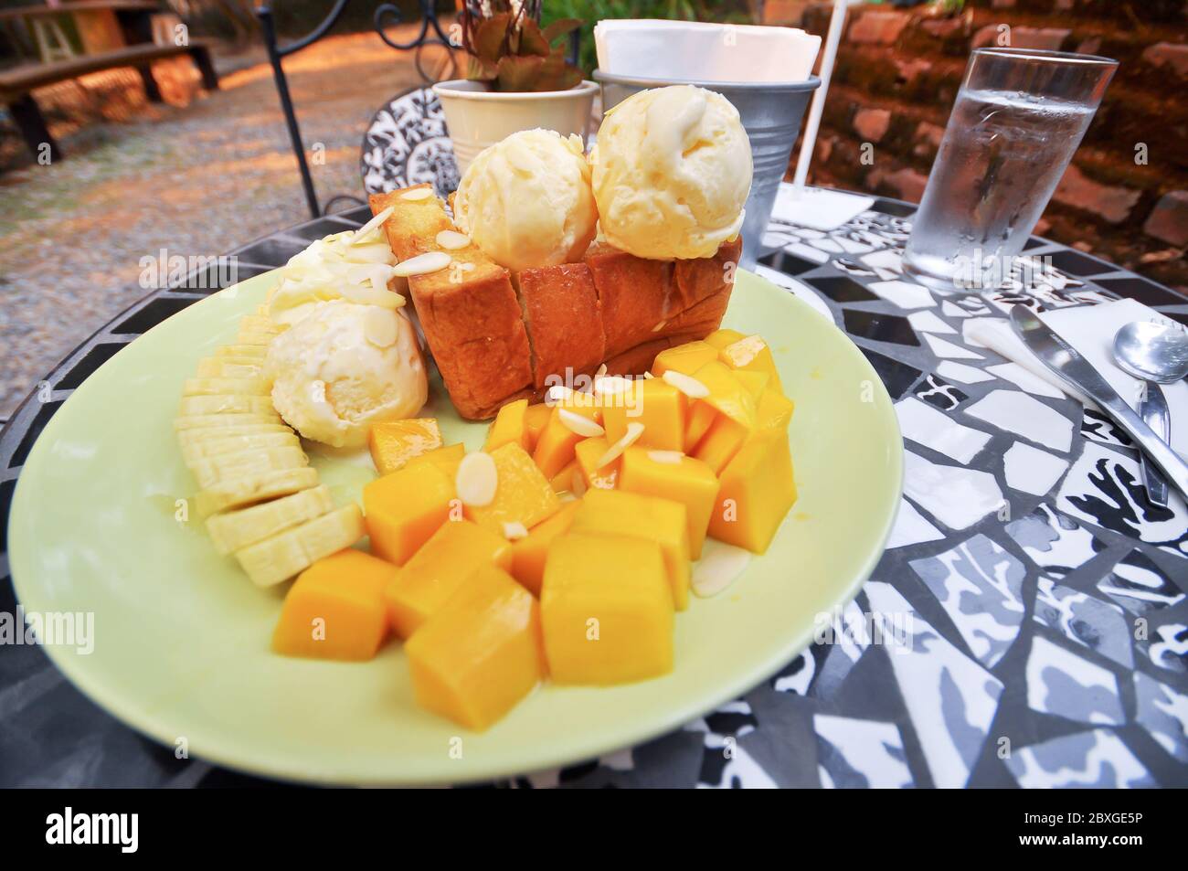 Honey toast with banana and mango. Stock Photo
