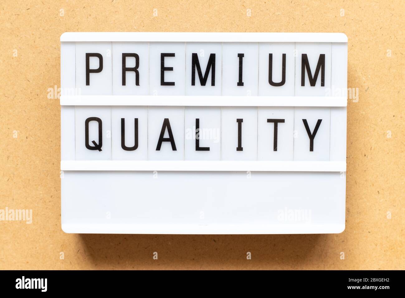 Lightbox with word premium quality on wood background Stock Photo