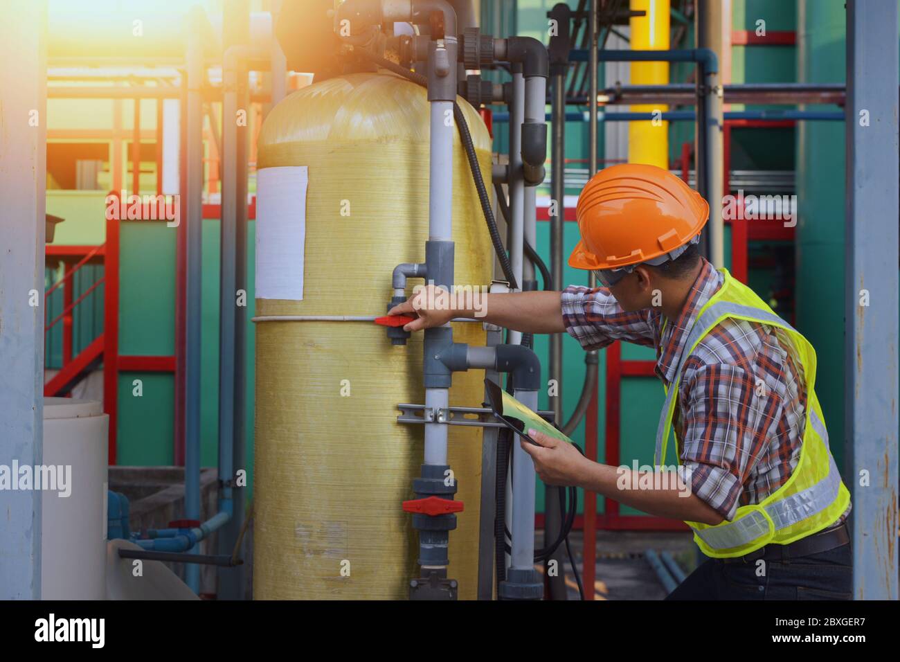 Engineer at a power plant using a digital tablet, Thailand Stock Photo