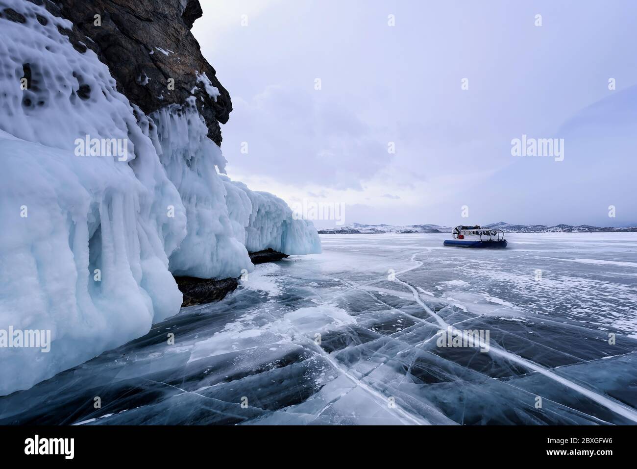 People Travel On The Ice Of The Frozen Lake Baikal In A Safe And Comfortable Hovercraft March Near A Rock Covered With Ice Stock Photo Alamy People Travel On The Ice Of The Frozen Lake Baikal In A Safe And Comfortable Hovercraft March Near A Rock Covered With Ice Stock Photo Alamy