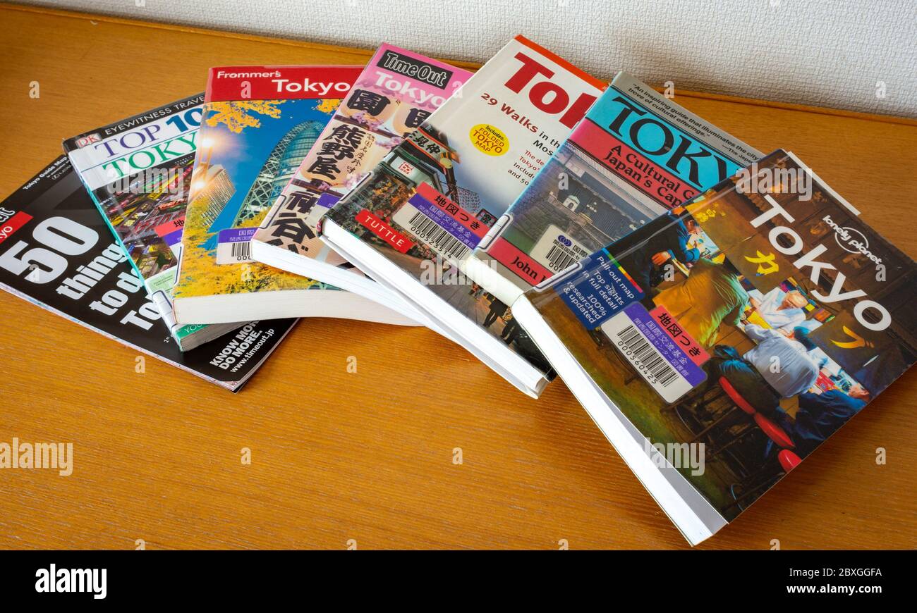 Tokyo / Japan - October 15, 2017: Various Tokyo travel guides spread on the table. Planning journey to Tokyo concept Stock Photo