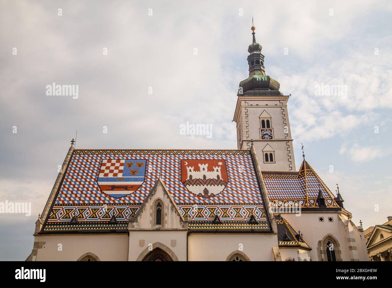 ZAGREB, CROATIA - 17TH AUGUST 2016: A closeup to the roof of St Marks Church in central Zagreb, Croatia during the day. Stock Photo