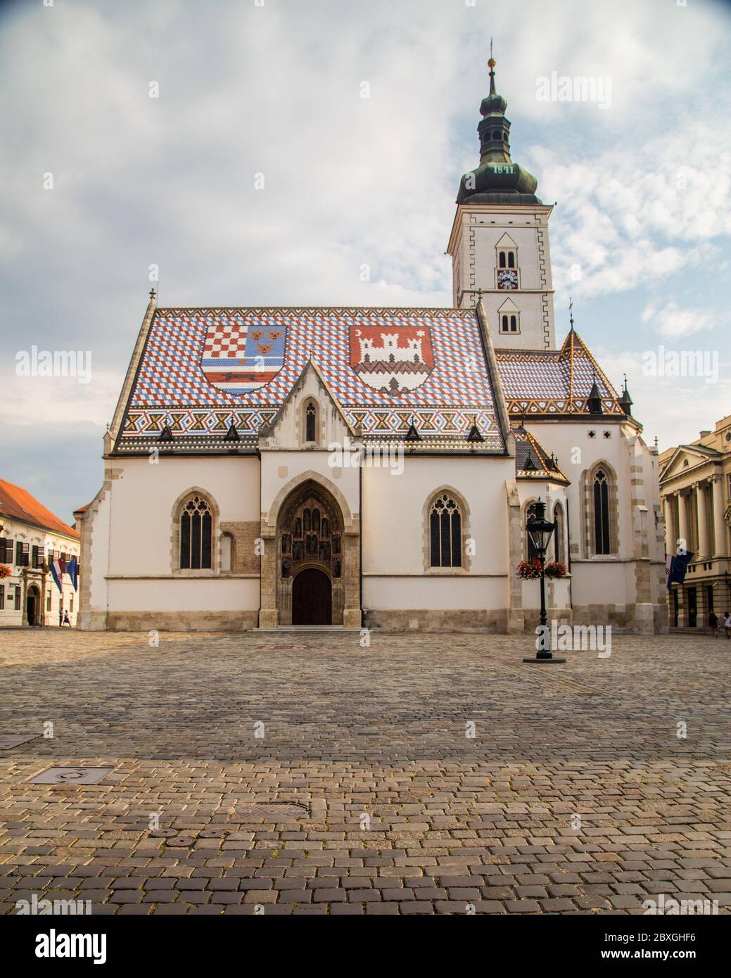 ZAGREB, CROATIA - 17TH AUGUST 2016: The outside of St Marks Church in central Zagreb, Croatia during the day. People can be seen. Stock Photo