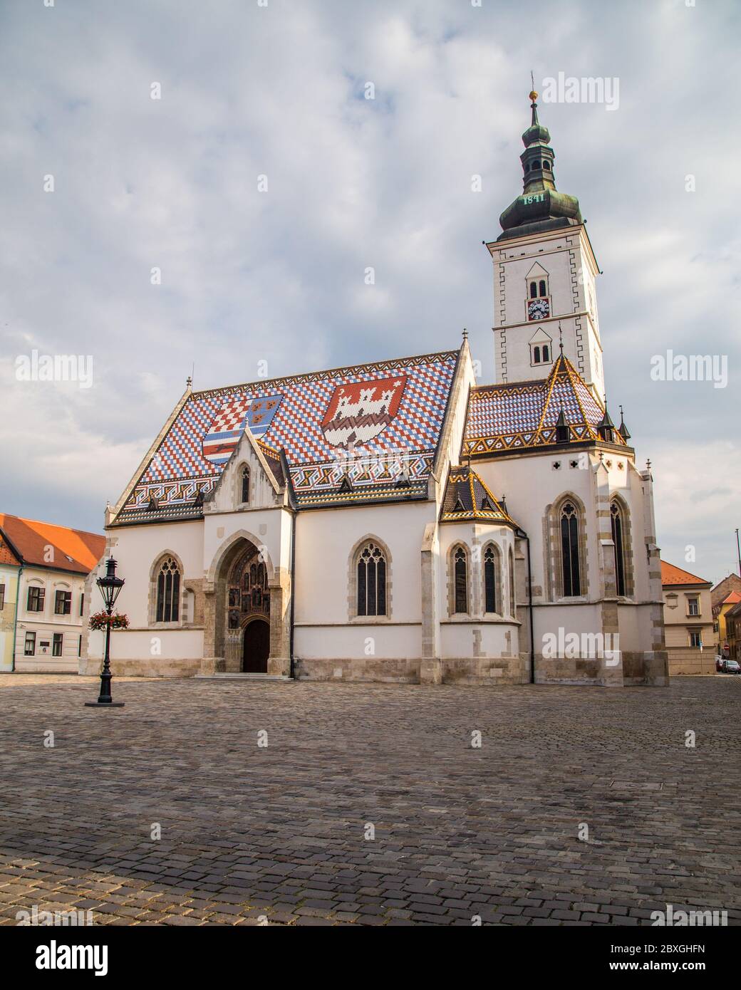 ZAGREB, CROATIA - 17TH AUGUST 2016: The outside of St Marks Church in central Zagreb, Croatia during the day. A person can be seen. Stock Photo