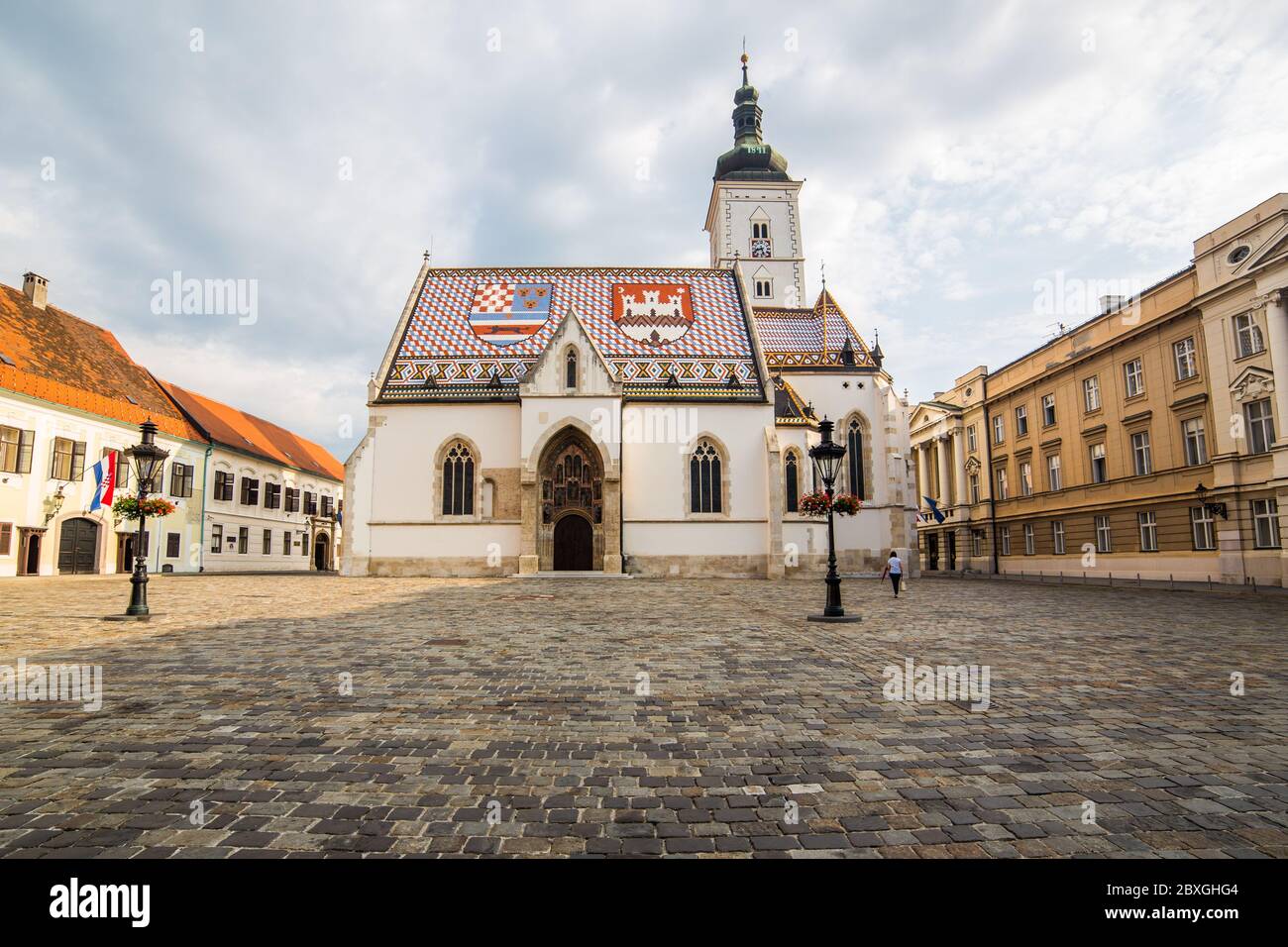 ZAGREB, CROATIA - 17TH AUGUST 2016: The outside of St Marks Church in central Zagreb, Croatia during the day. A person can be seen. Stock Photo