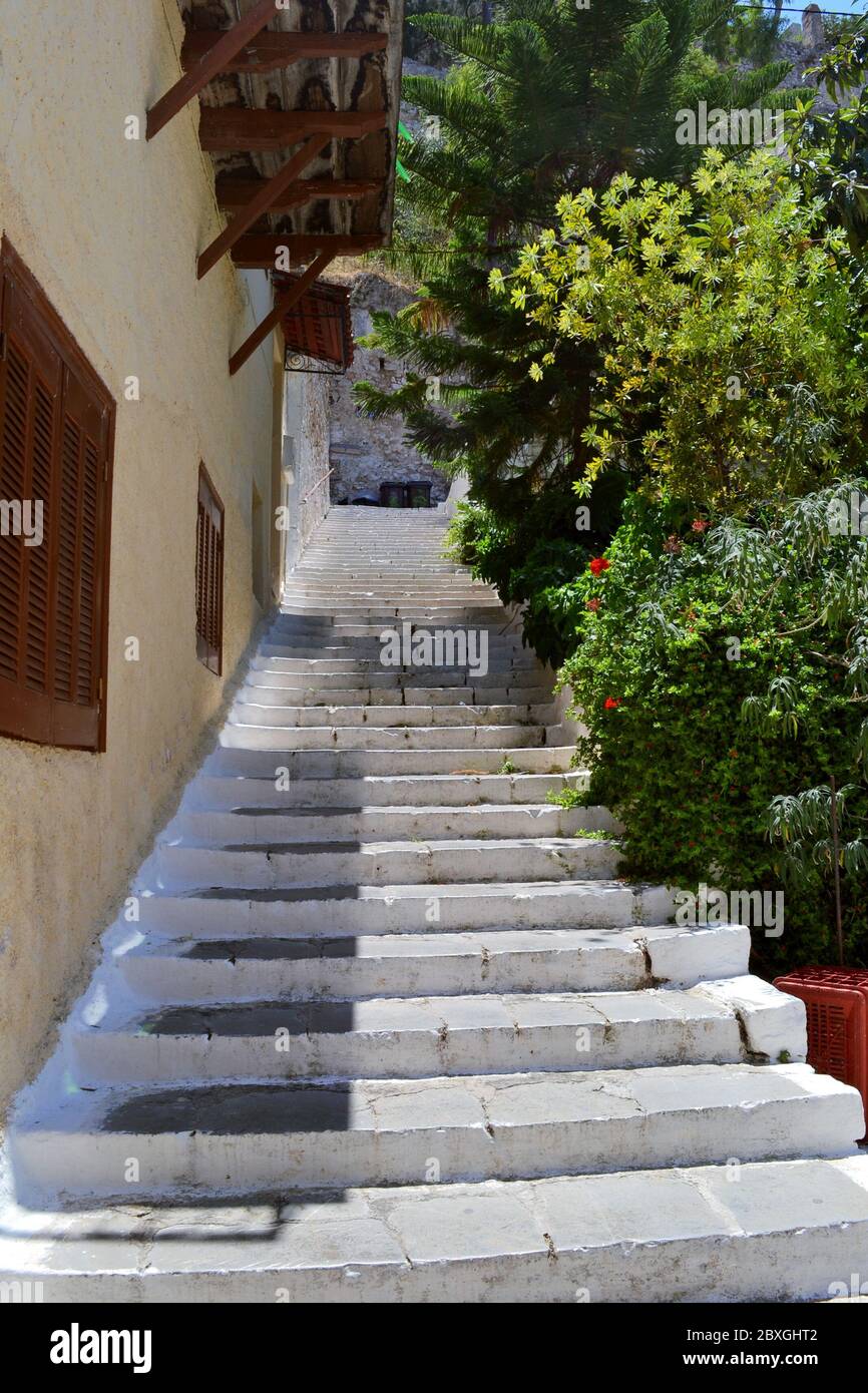 Stairs going up next to a house in historic old town of Nafplio, Greece. Stock Photo