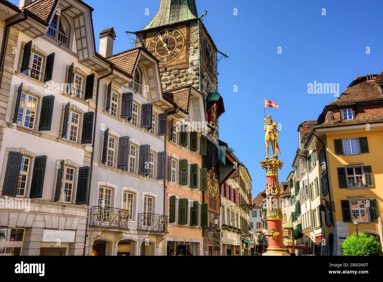 Historical Old town center of Solothurn city, Switzerland, with the Clock tower and St. Ursen statue Stock Photo