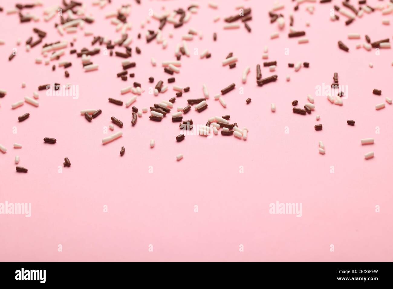 Abstract pink background with sprinkles Stock Photo