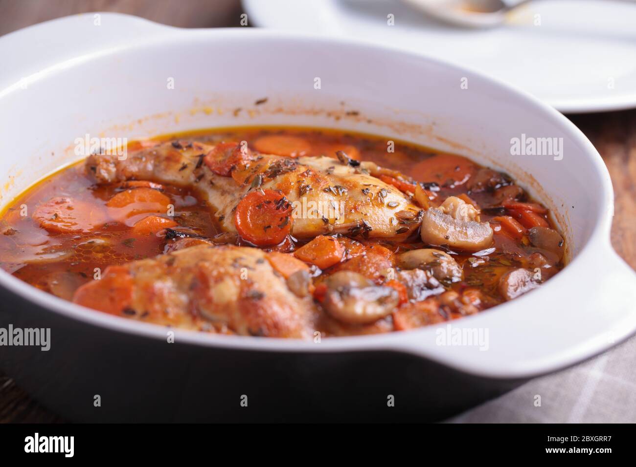 Hunters rabbit stew with carrot in a pan. Closeup view Stock Photo