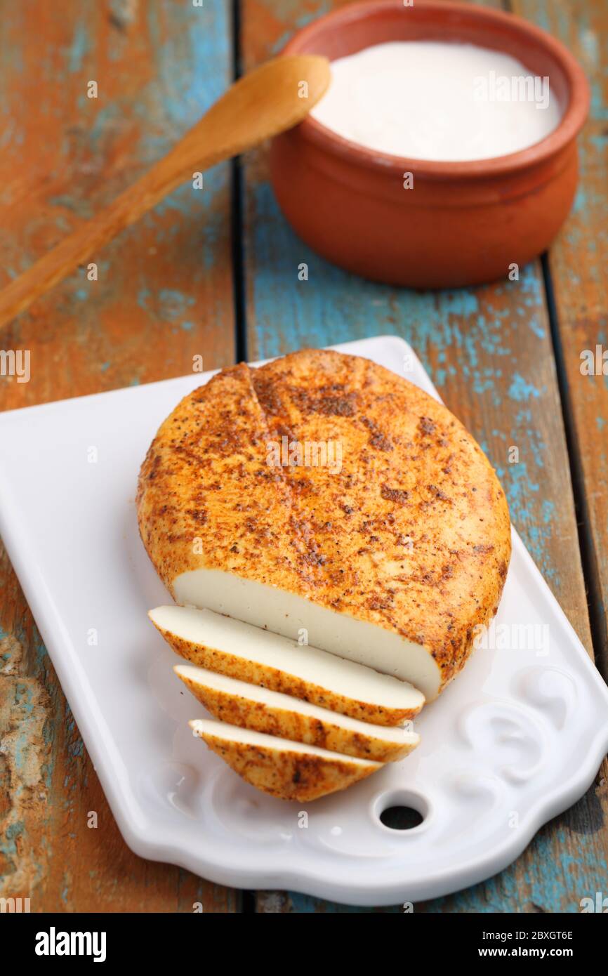 Lithuanian fried cheese on a rustic table Stock Photo