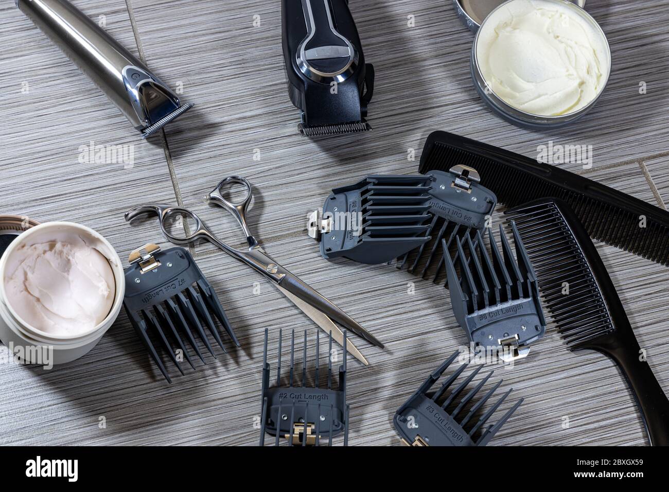 an assortment of tools and equipment used by professional barbers or hair stylists Stock Photo