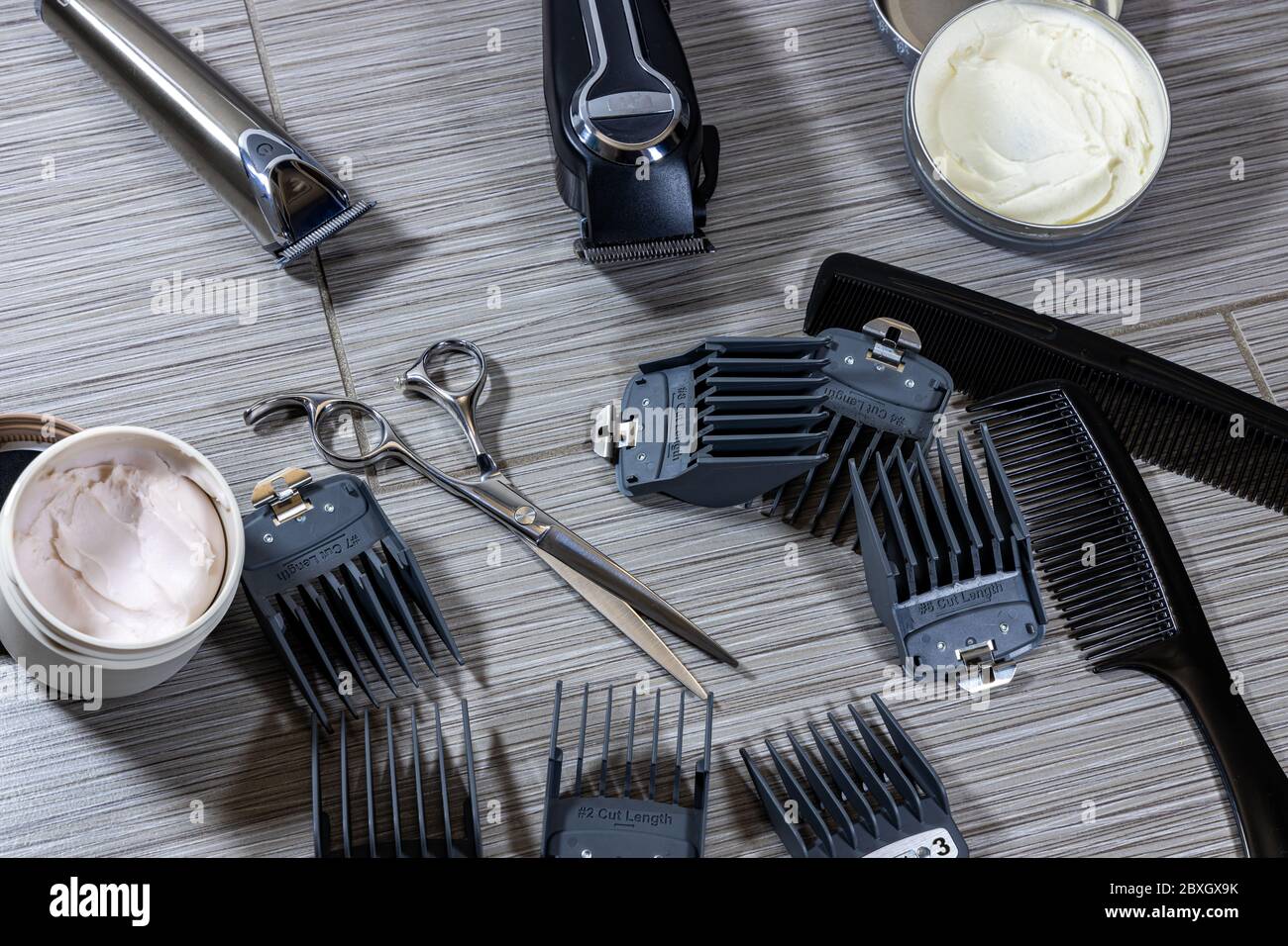 an assortment of tools and equipment used by professional barbers or hair stylists Stock Photo