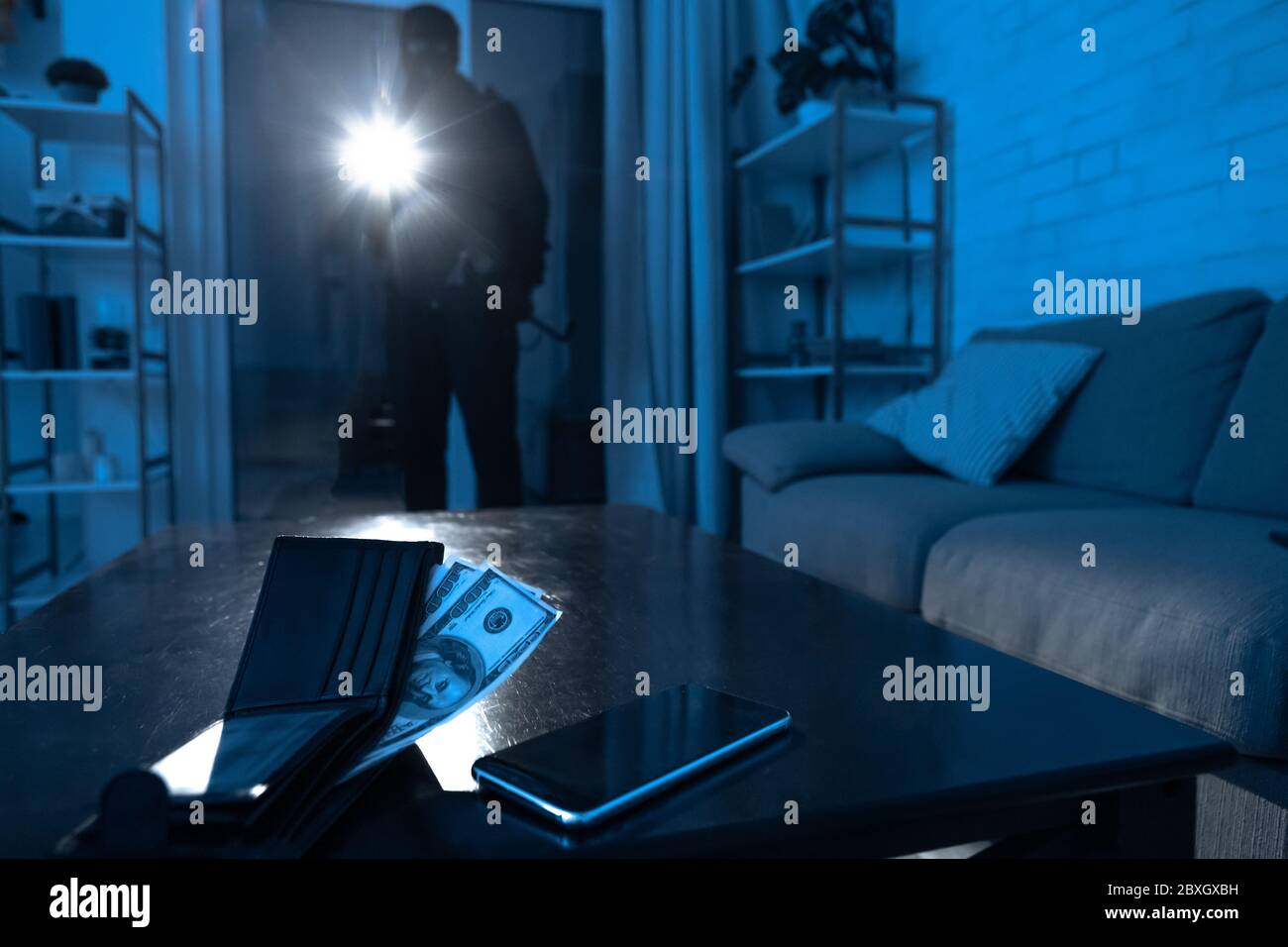 Robber breaking in an apartment to steal something Stock Photo Alamy