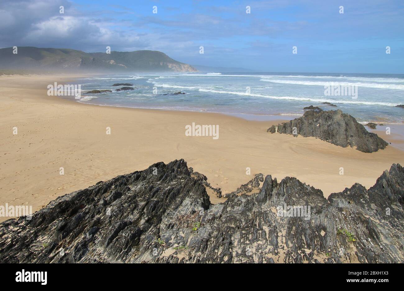 Cragged cliffs on the beach of Nature's Valley, Garden Route, South Africa, Africa. Stock Photo